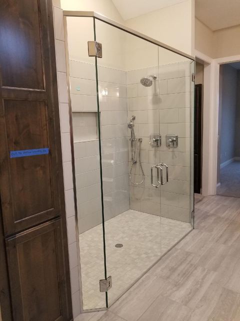 Frameless corner shower with brushed nickel hardware