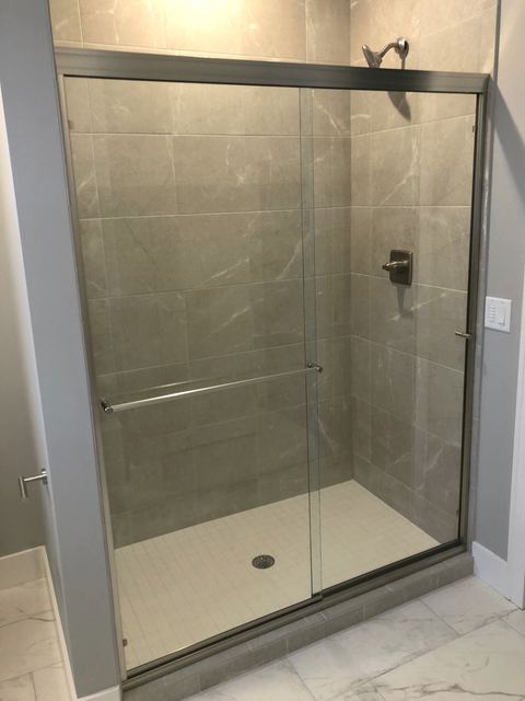 Framed sliding shower doors