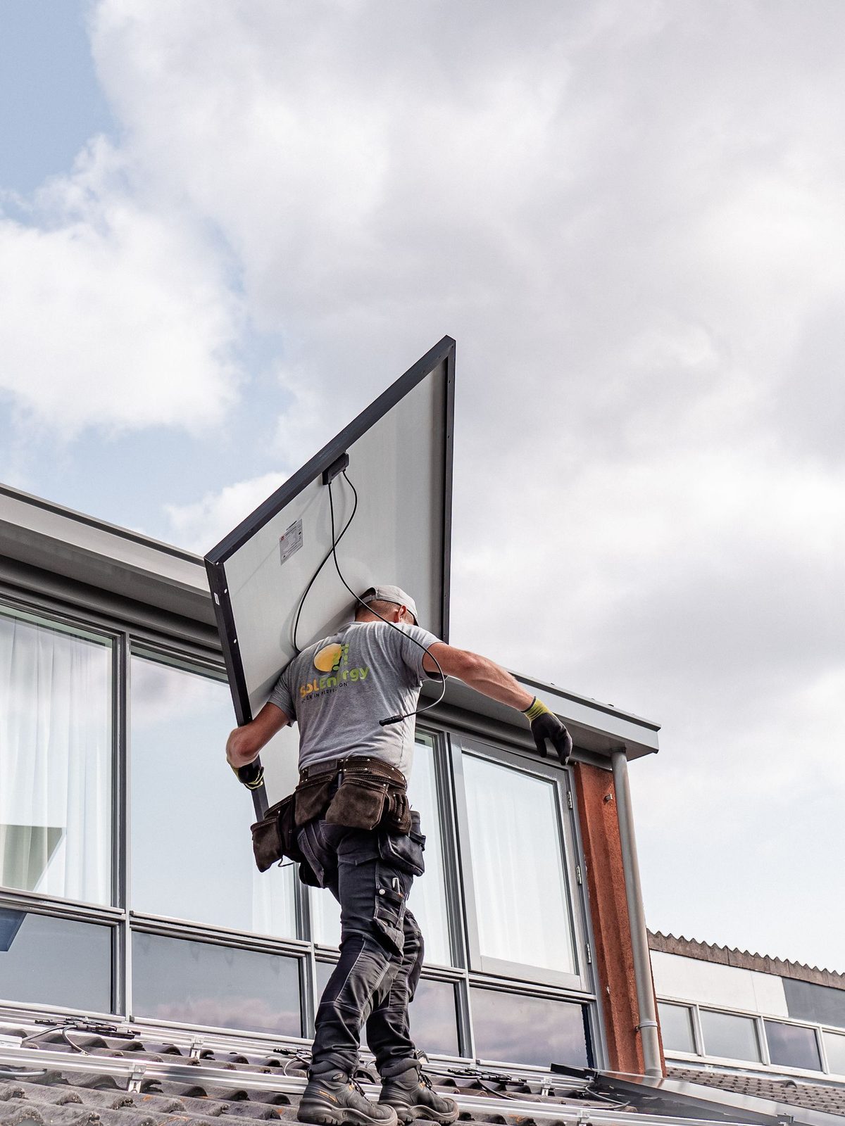 Glazier installing a window