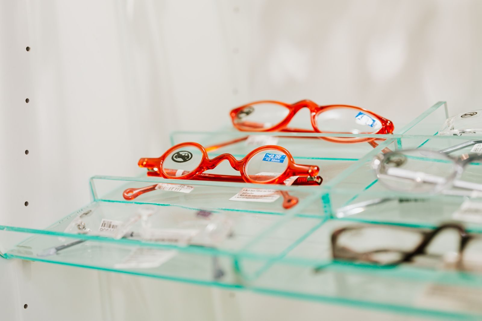 Eyeglasses displayed on bonded glass cubes